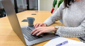 creating a group travel checklist list on a laptop