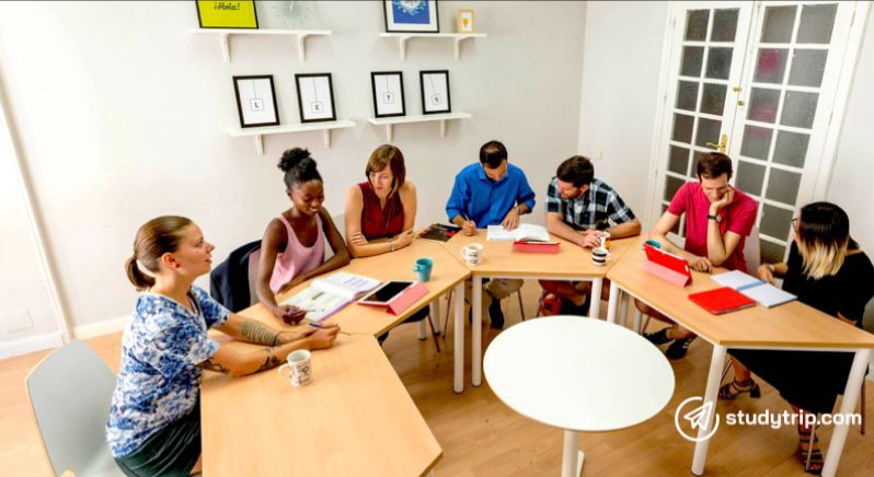 students studying around a desk