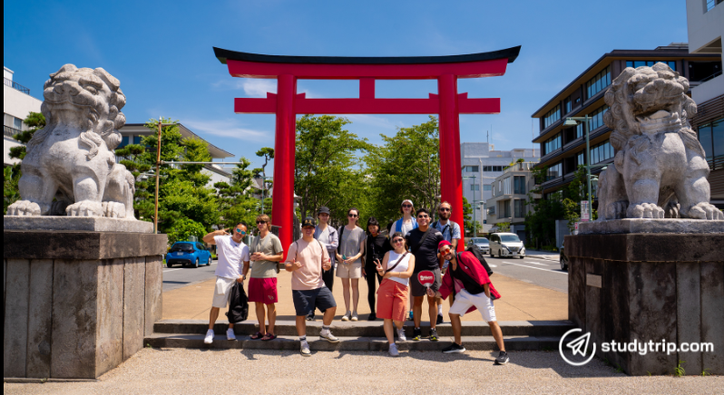 group of students in front of tori gate